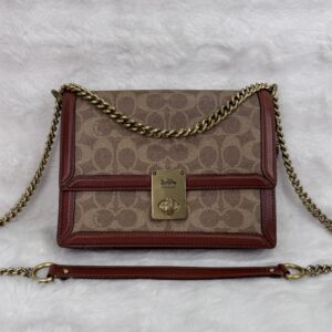 Coach Hutton Signature Canvas Shoulder bag in Rust brown