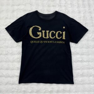 Gucci Gold wording "Queelle Qu'en Soit La Saison" Black Tee